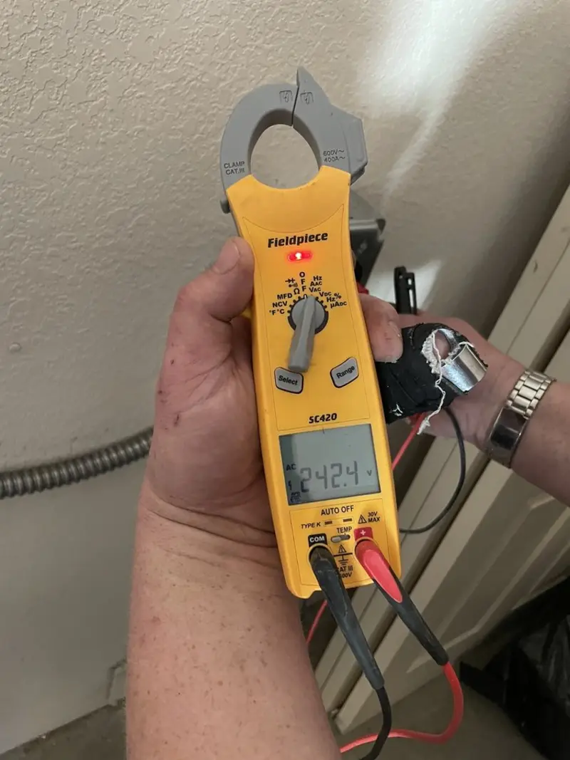 Voltage testing with clamp meter during Circuit Breaker Repair in South Kensington